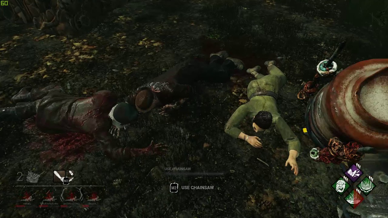 A group of survivors left injured on the ground by the Killer
